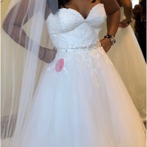 I’m selling a Christina Wu Wedding Dress. Never worn